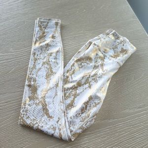 Carbon 38.  Brand new never worn.  Gold and white.